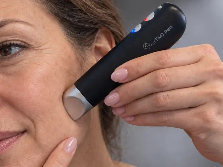 Pressing the yourTMJ Pen tip into the jaw muscle